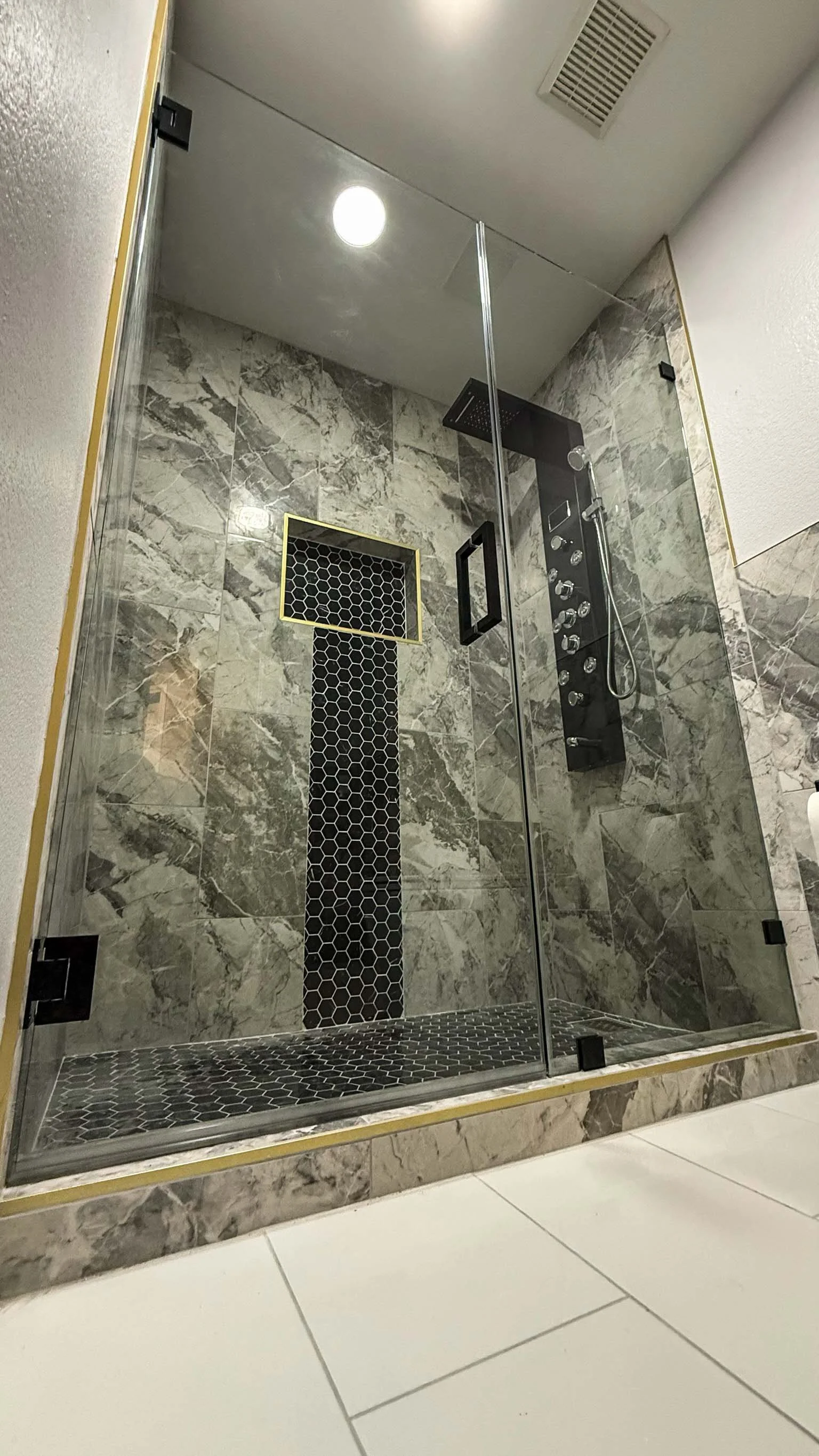 modern frameless shower door with minimal hardware