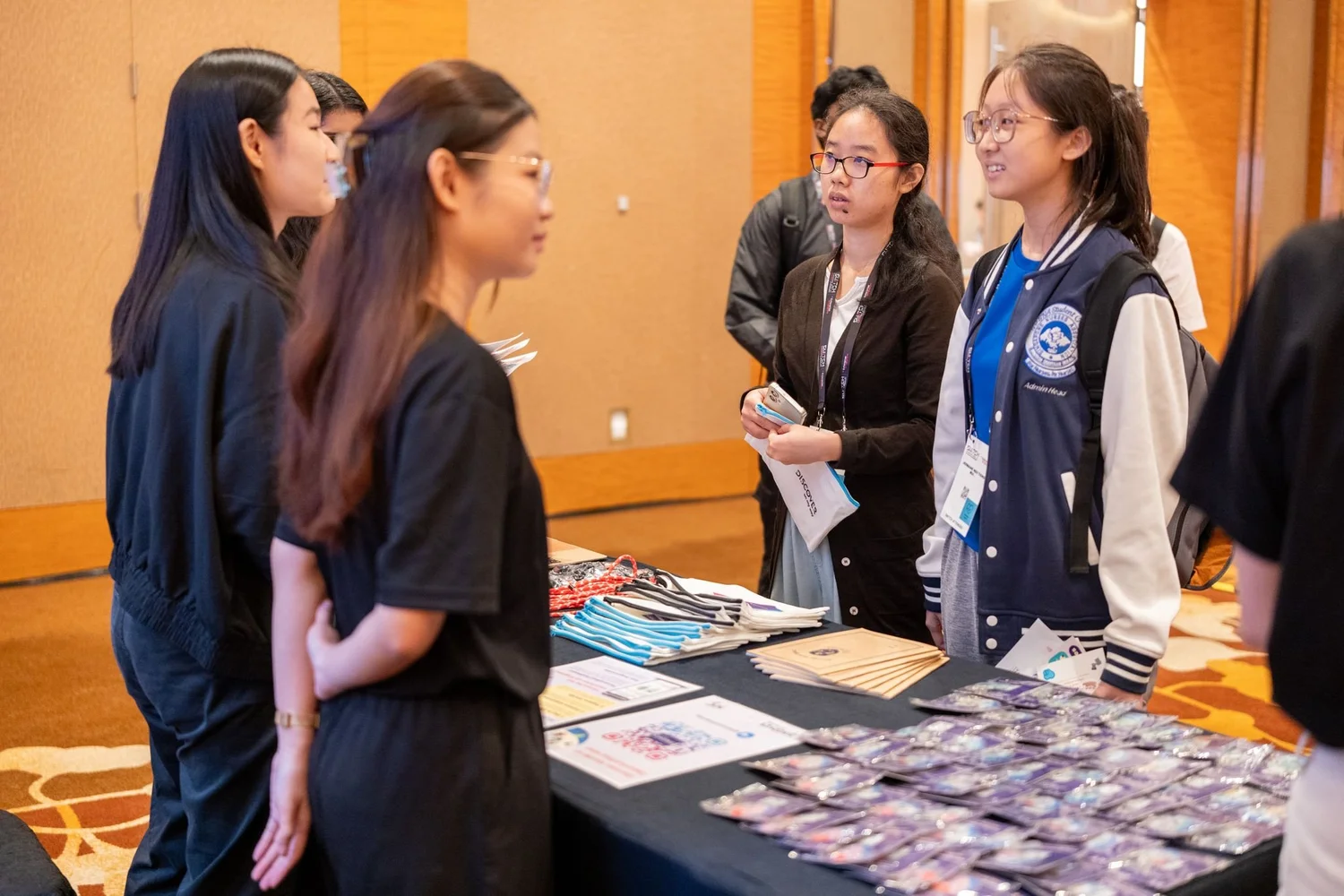 Youth participants speak with an industry partner at a WorkWindows station