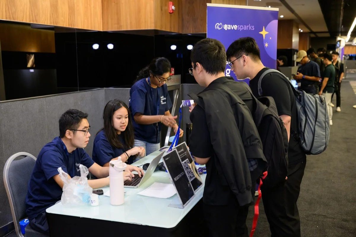 Attendees check in at the Wavesparks registration desk