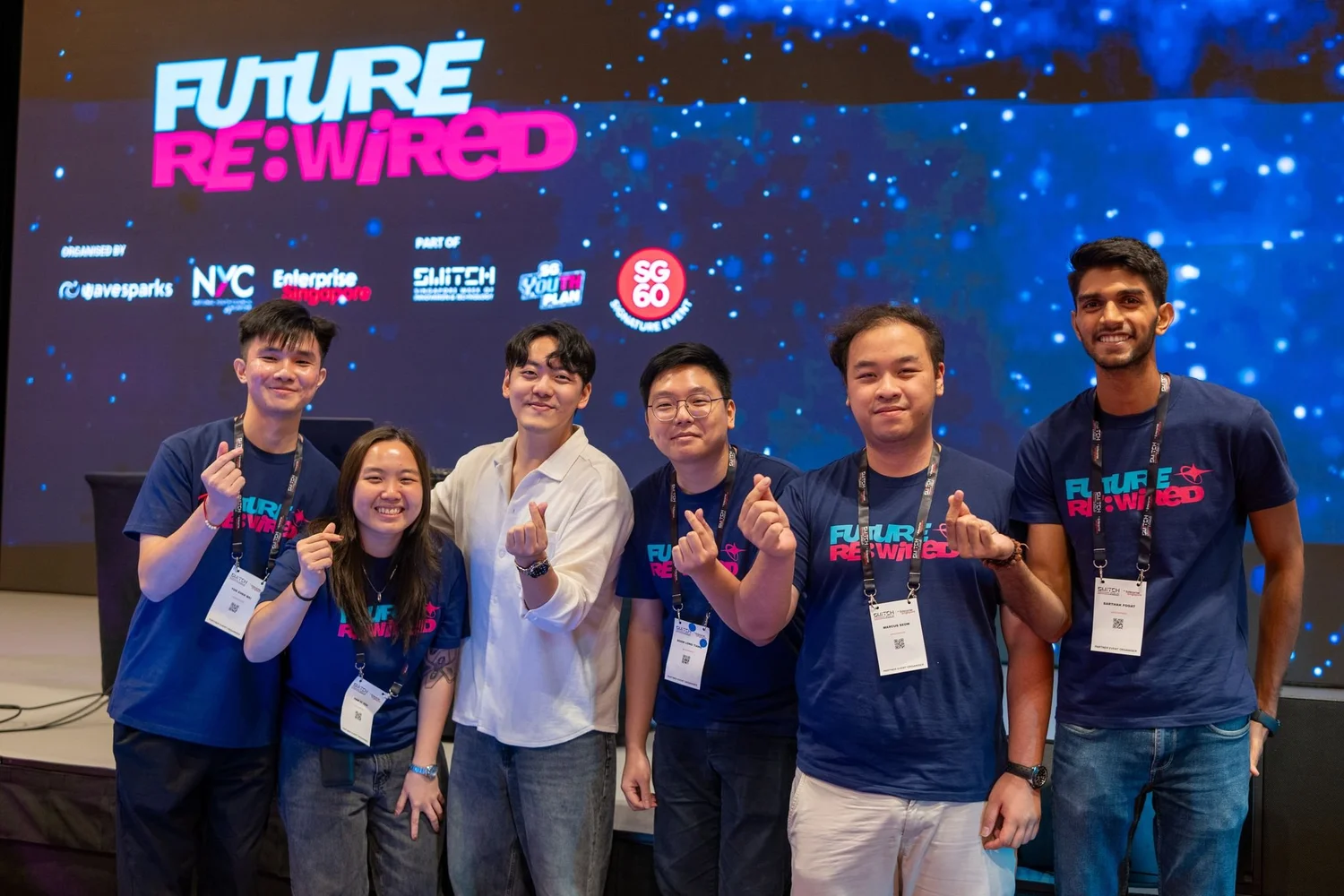 Future Re:Wired organisers and participants pose together in front of the main stage