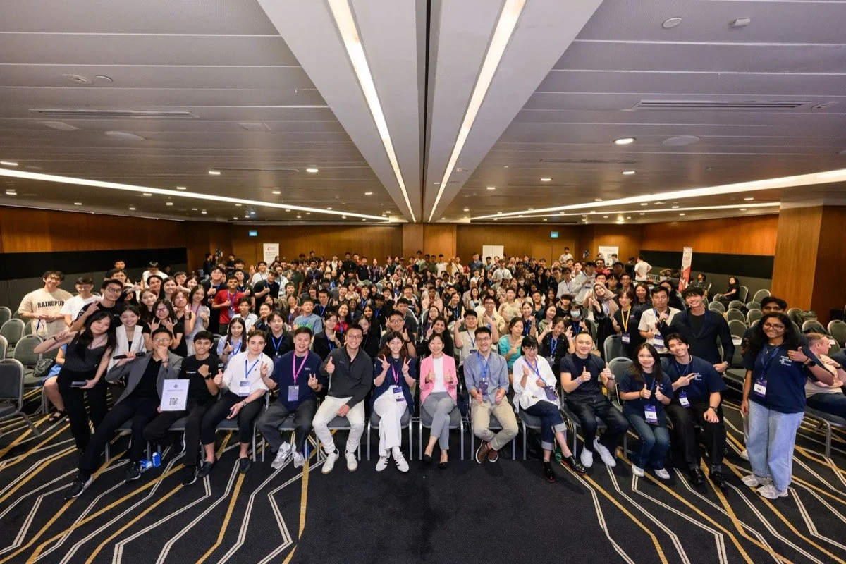 TheFirst Spark attendees, speakers, and organisers gather for a group photo
