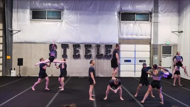 Full Send Circus artists performing several group acrobatic balances