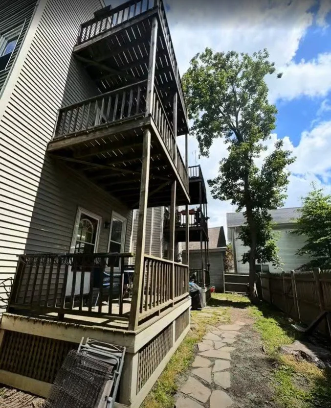 Old worn triple deck before renovation - Somerville MA multi-family home