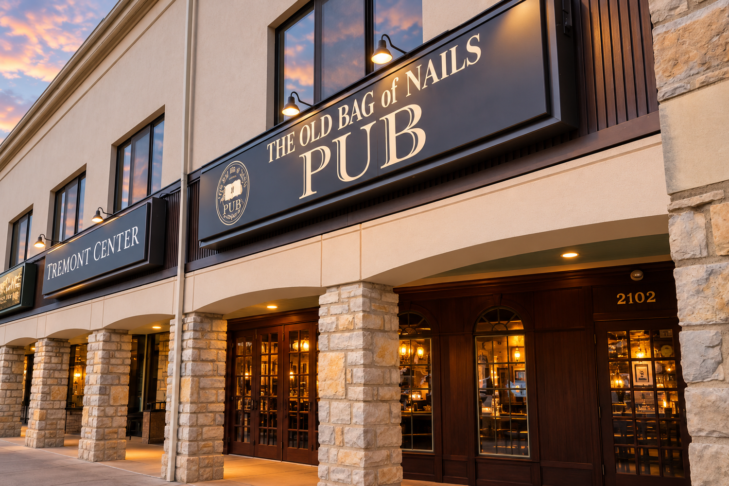 Neighborhood pub and covered storefront walkway at Tremont Center.