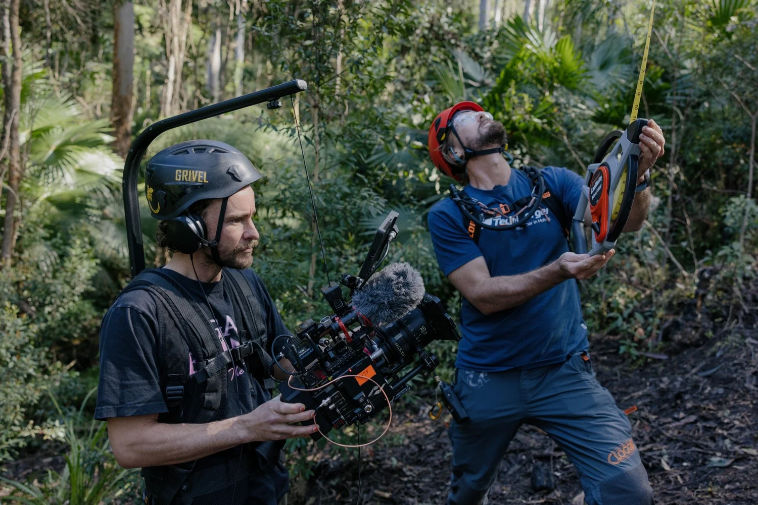 Filming the measuring process beneath Big Spotty, with camera and measuring tape.