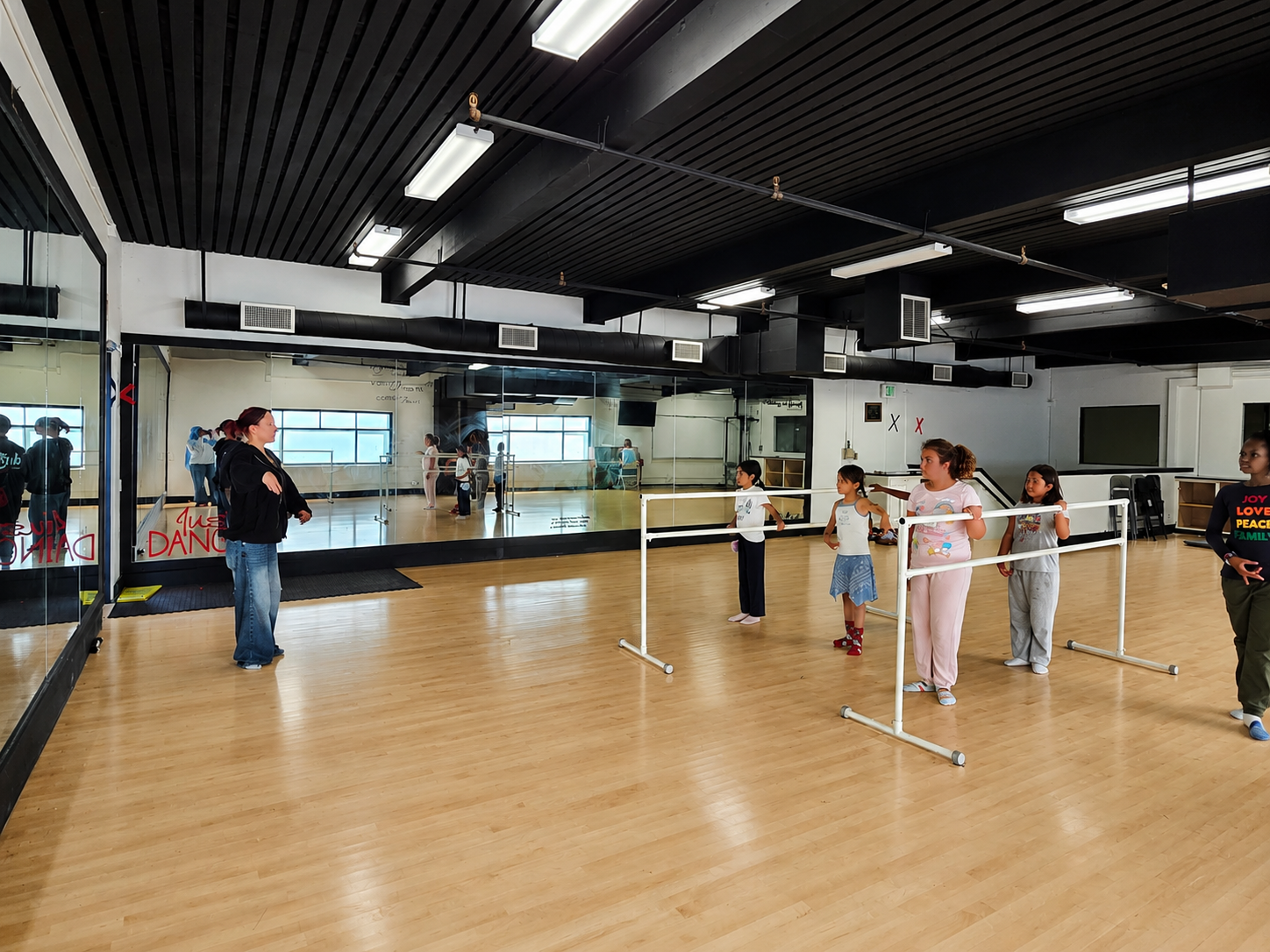 Young people participating together in a dance program