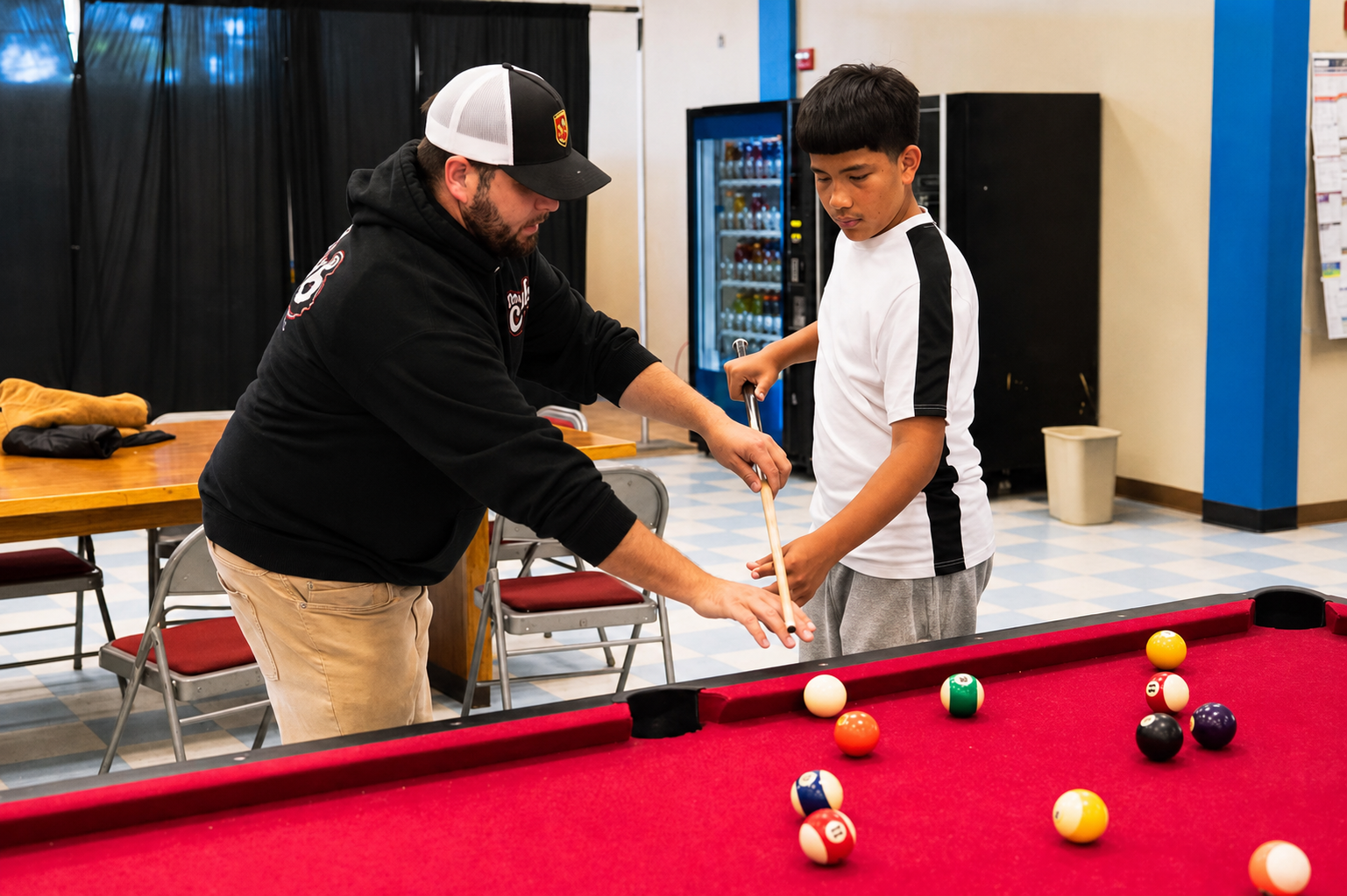 Staff member mentoring a young person at The Club