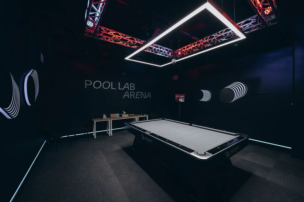 The Pool Lab Arena: a Rasson 9ft tournament pool table with Simonis 860HR cloth under a Predator LED table light, for PRO members