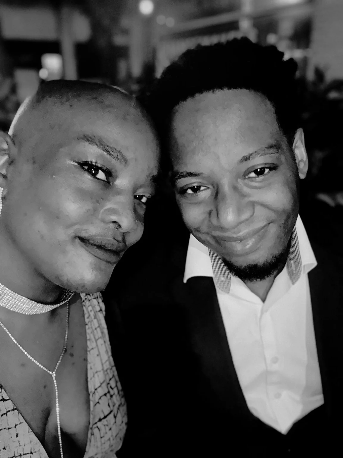 Anorah and Reggie dressed up together in black and white