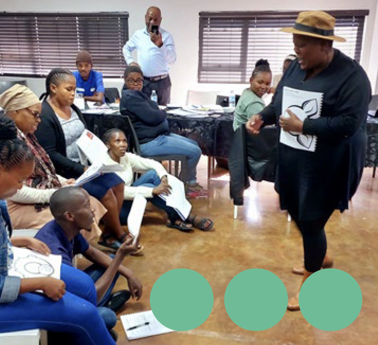 Zoë-Life facilitator working with children and caregivers