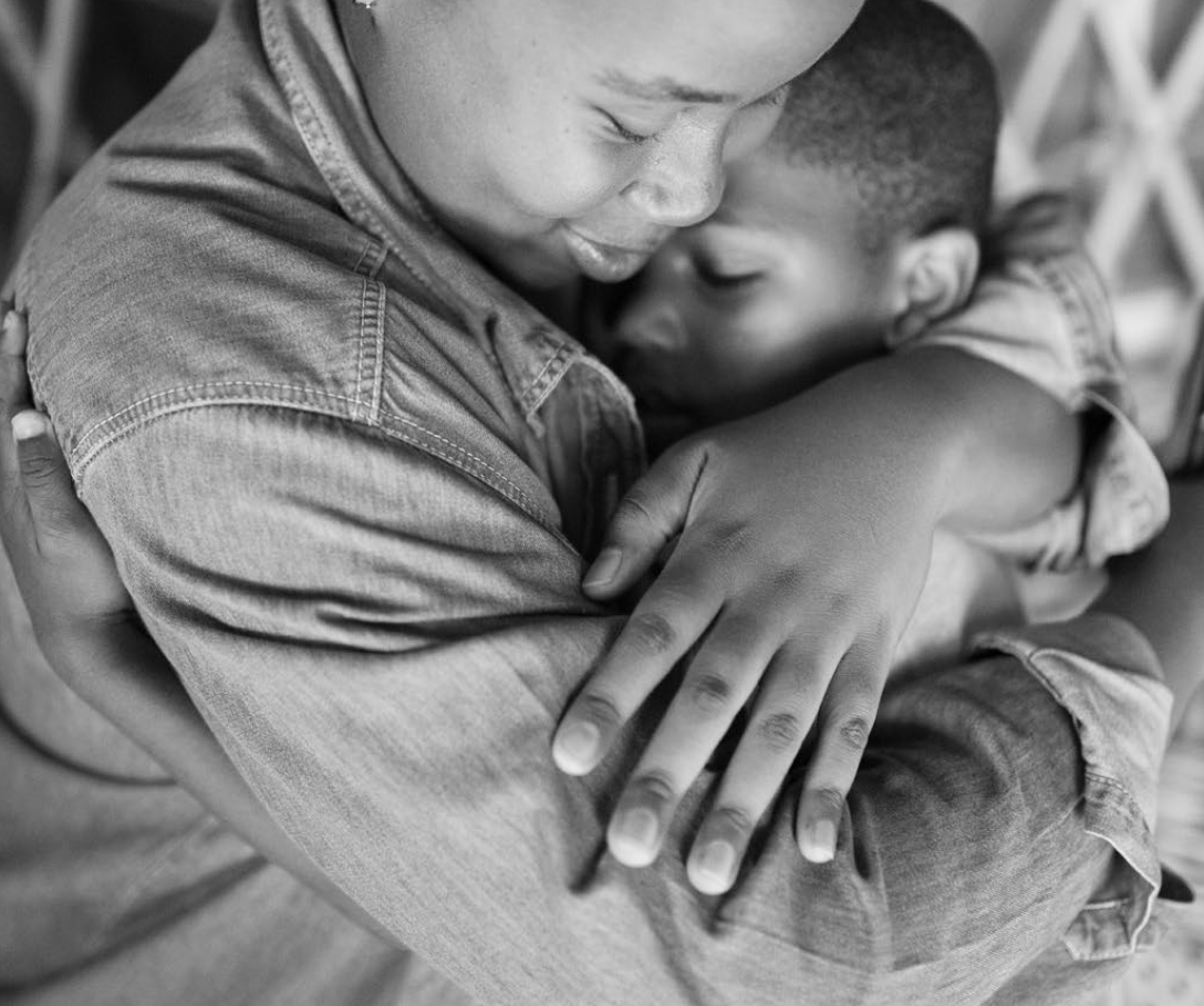 Children sharing a supportive embrace