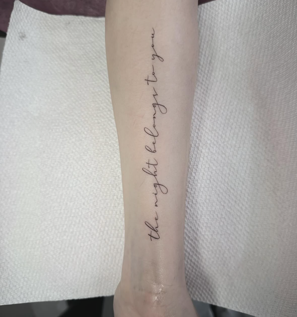 Vertical Script fine-line tattoo