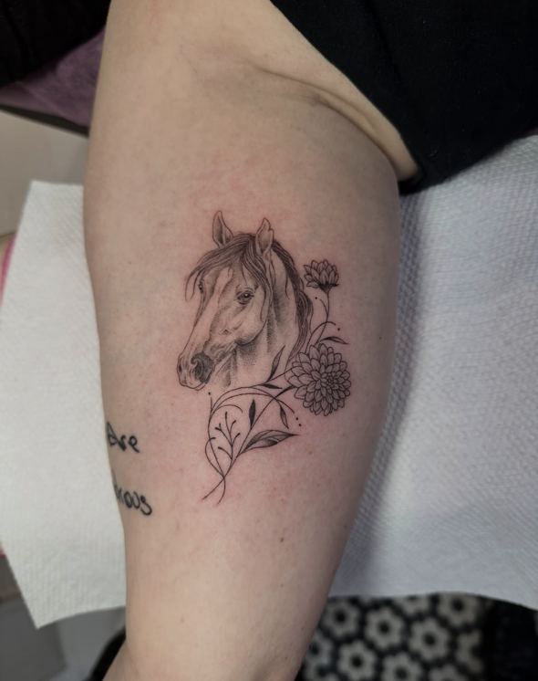 Horse and Flowers fine-line tattoo