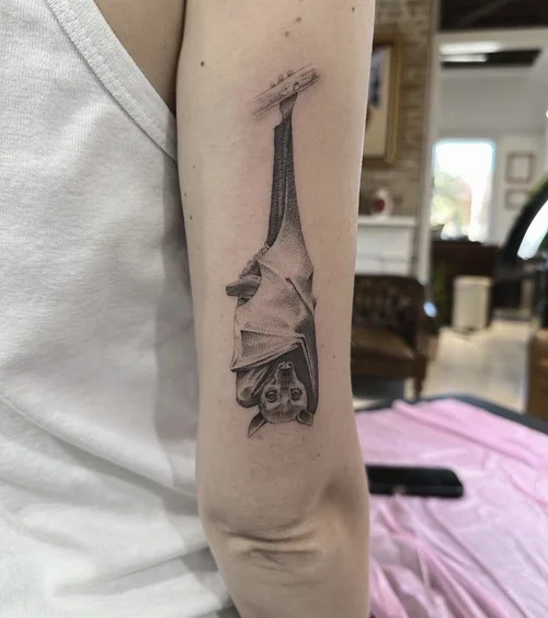 Hanging bat tattoo