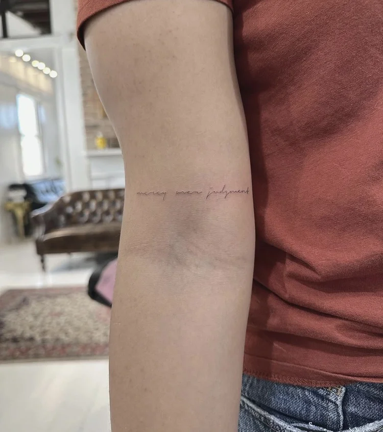 Micro Script Line fine-line tattoo