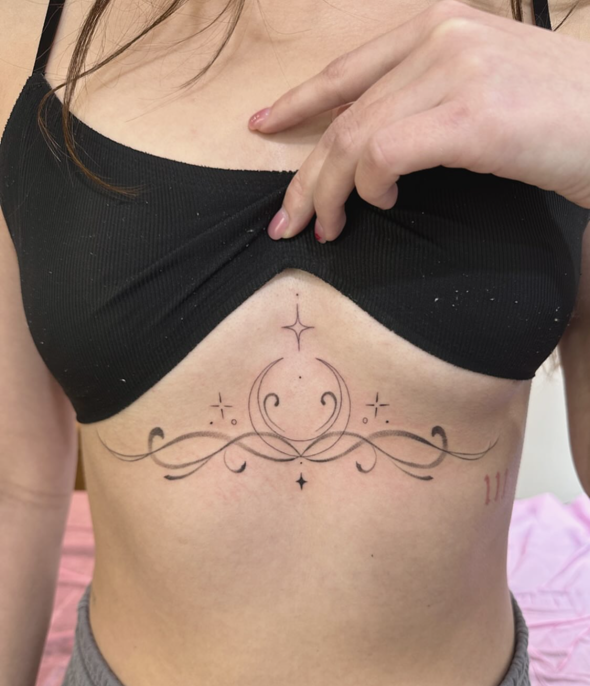Sternum Ornament fine-line tattoo