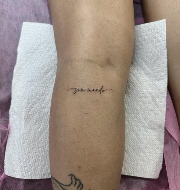 Forearm Script fine-line tattoo