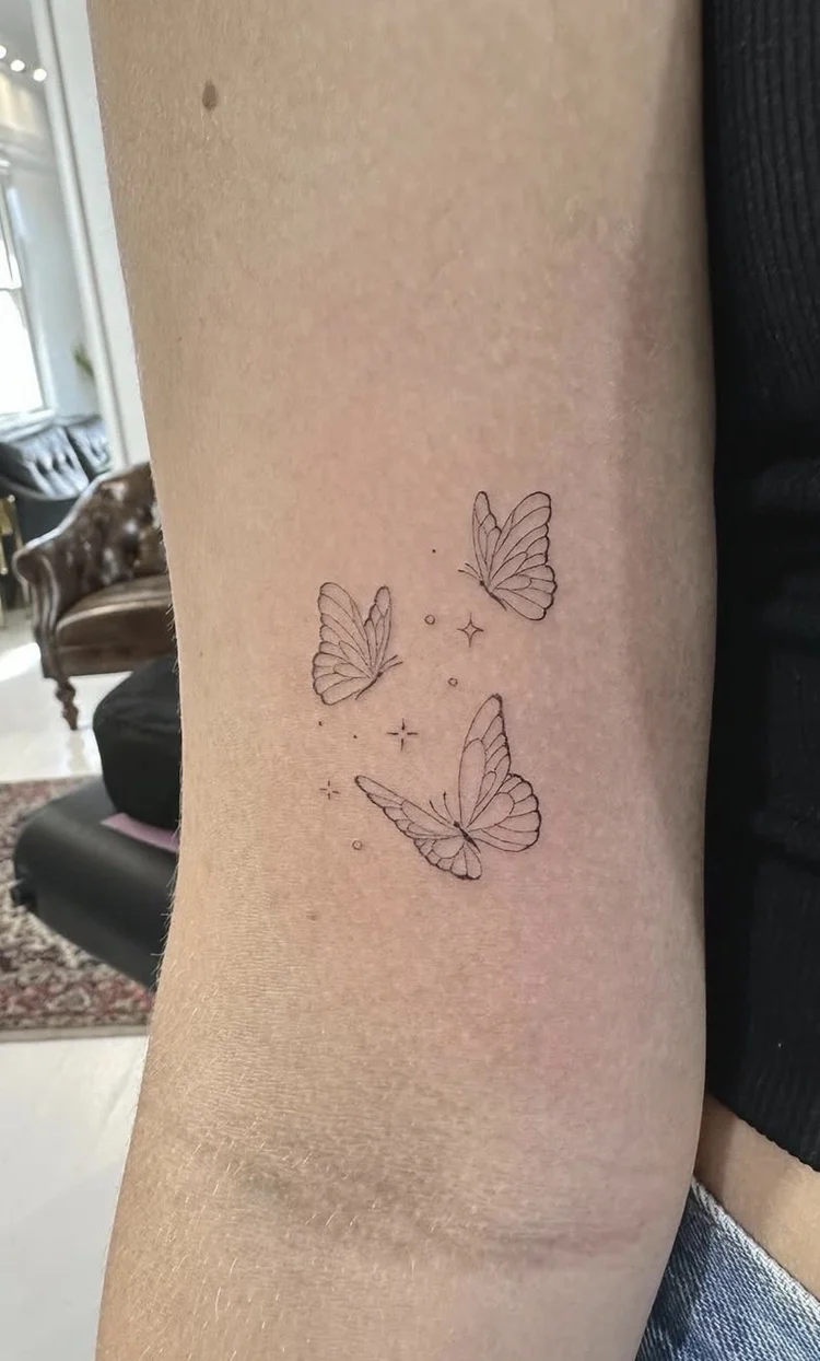 Butterflies in Flight fine-line tattoo