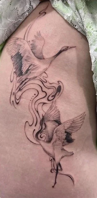 Cranes in Flight fine-line tattoo