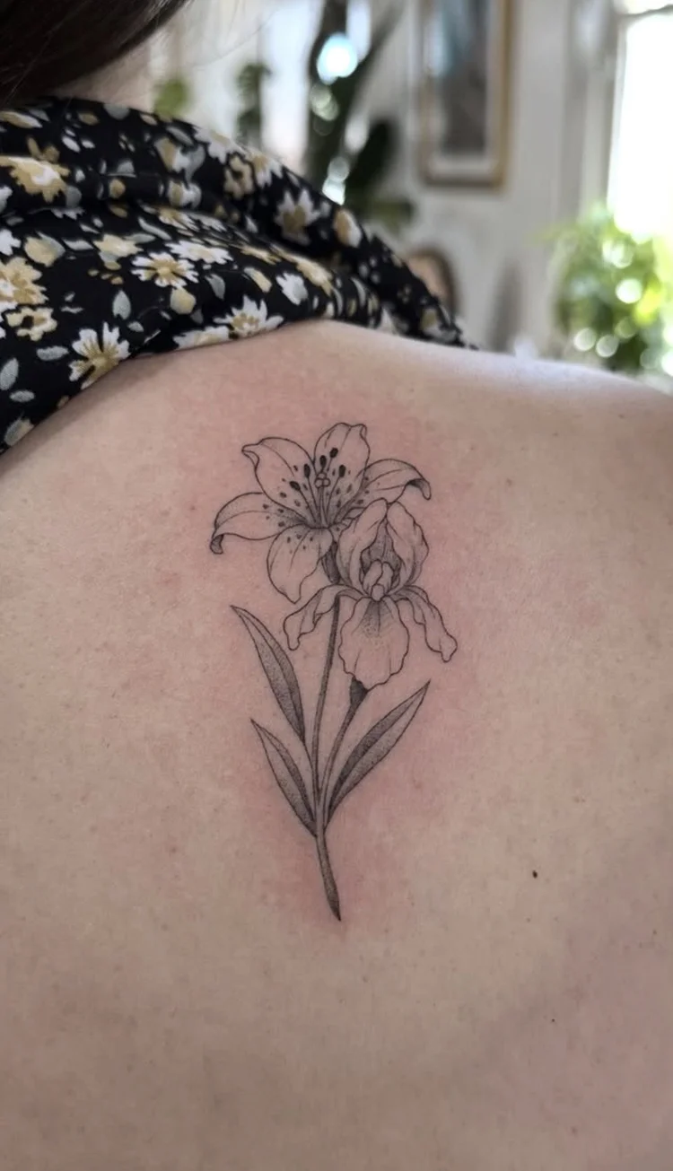 Lily in Bloom fine-line tattoo