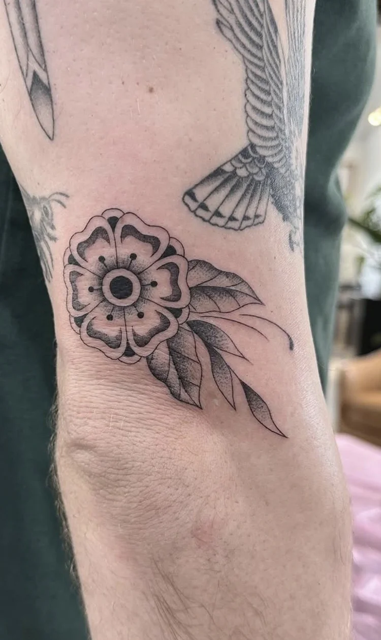 Dotwork Blossom fine-line tattoo