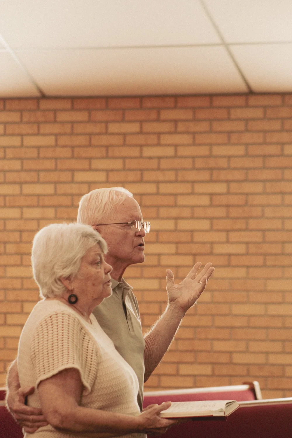Two church members worshipping together