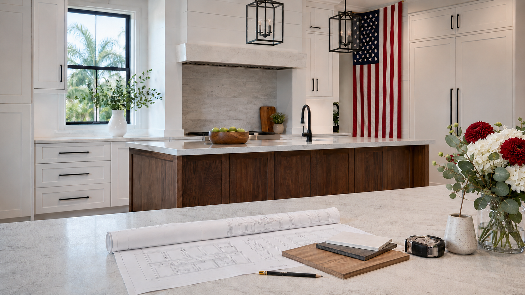 Luxury cabinetry showroom prepared for Labor Day with American flag, cabinet plans and finish samples