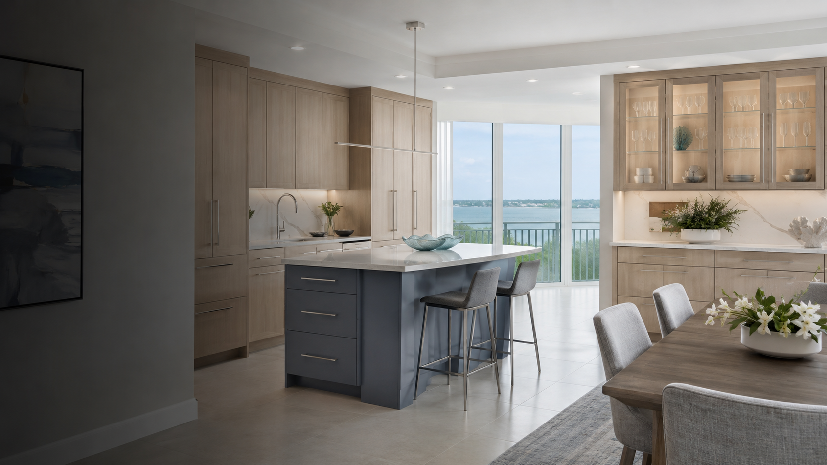 Efficient South Pasadena waterfront kitchen with white oak cabinetry, dusty-blue island and dining-room built-in storage