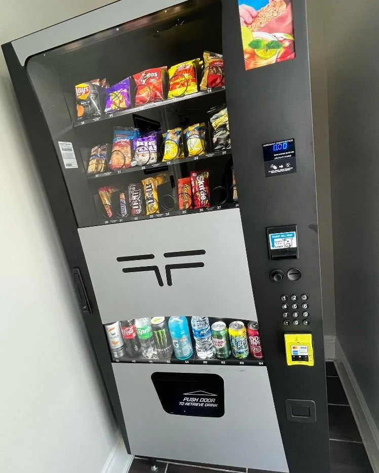 BobbySnaqs snack and drink combo vending machine installed at an apartment community