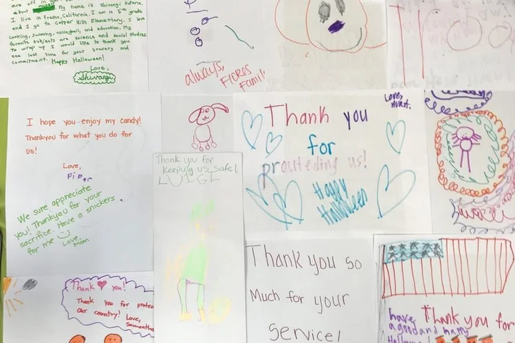 Wall of handwritten thank-you notes from kids