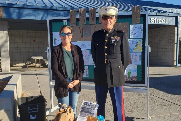 A Marine in dress blues at a school collection day