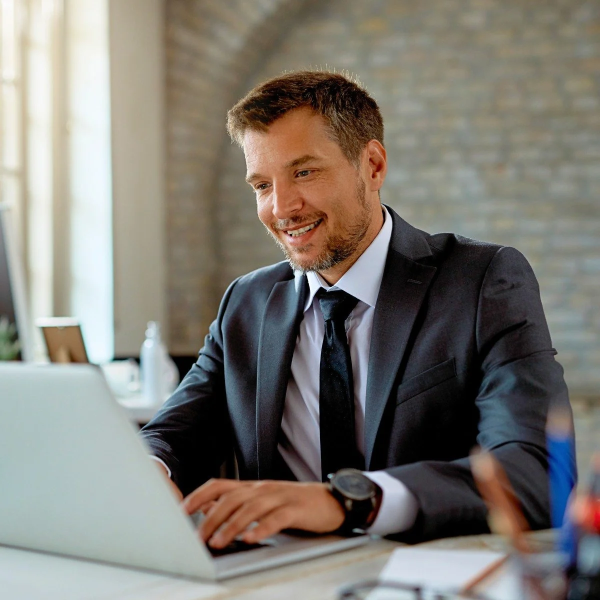Professional completing ISO 9001 Internal Auditor training on a laptop