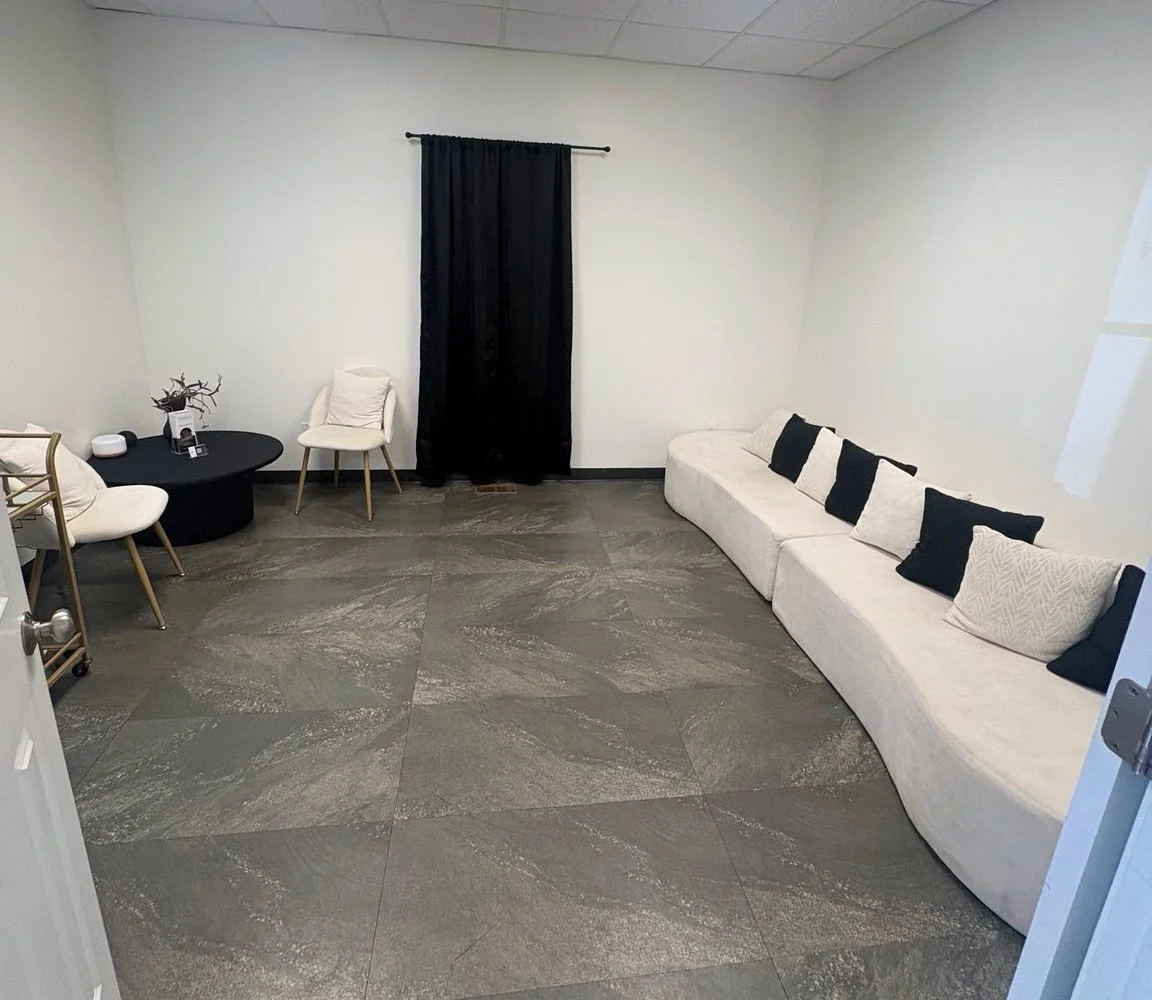 White seating in the lounge at our Oconee spa