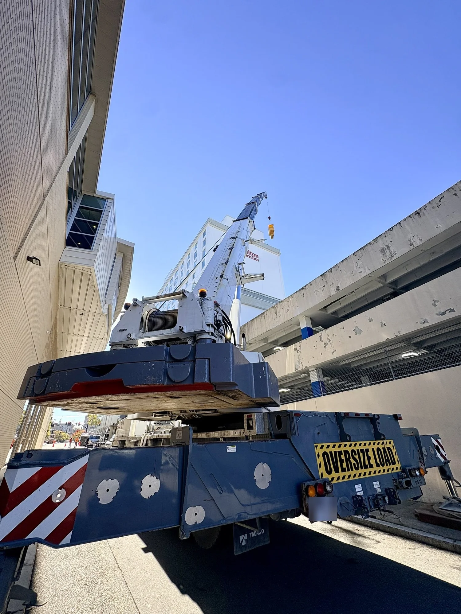Roy Corp Tadano ATF 220G-5 set up beside the Hilton hotel in Providence, RI, with a man basket on 223 ft of main boom, next to the Amica Mutual Pavilion