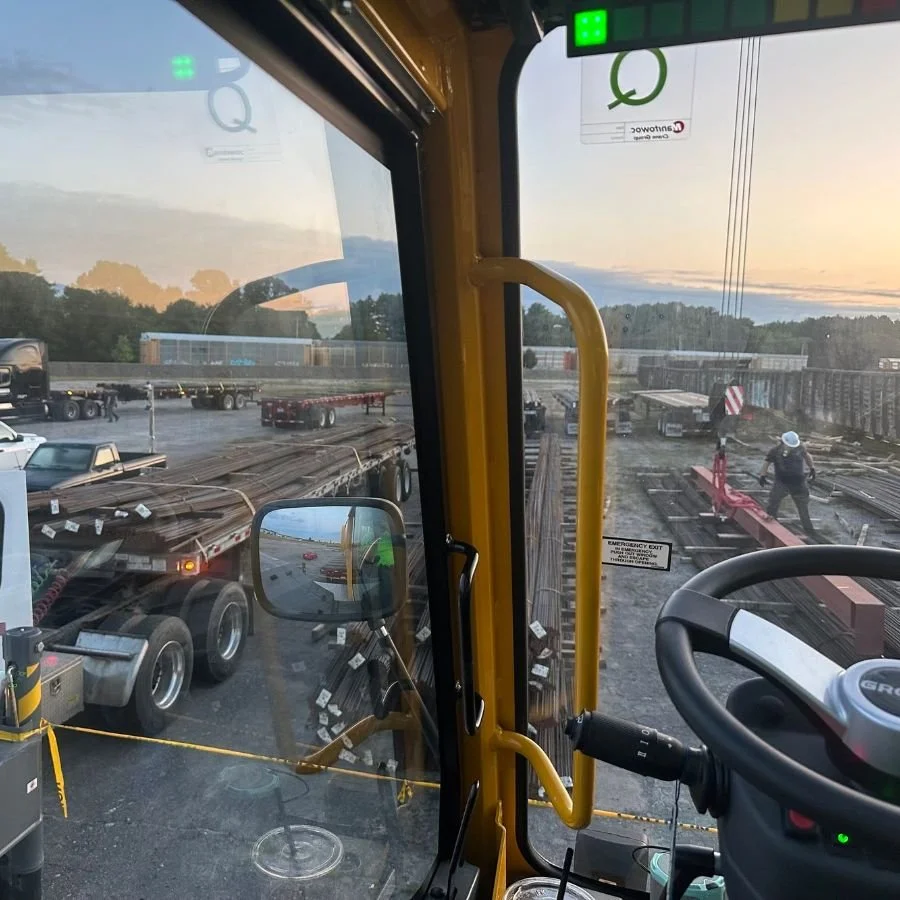 View from the Roy Corp crane cab over the rail transloading yard at sunrise