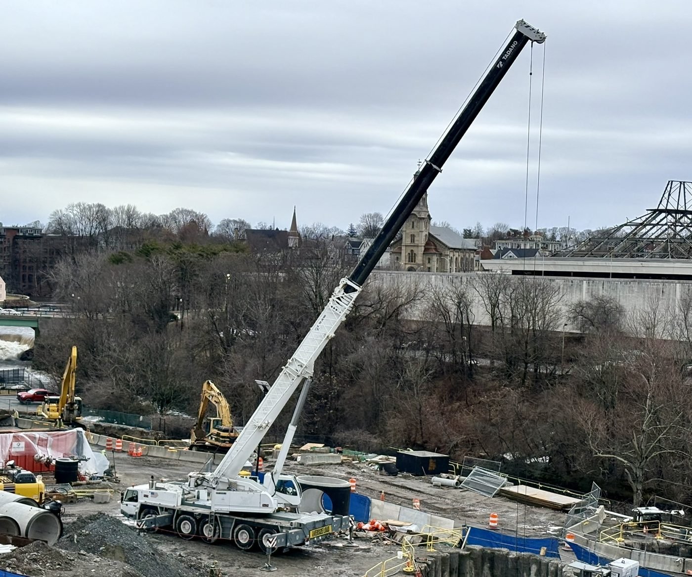 Roy Corp Tadano ATF 220G-5 250-ton all-terrain crane with boom extended on a construction site