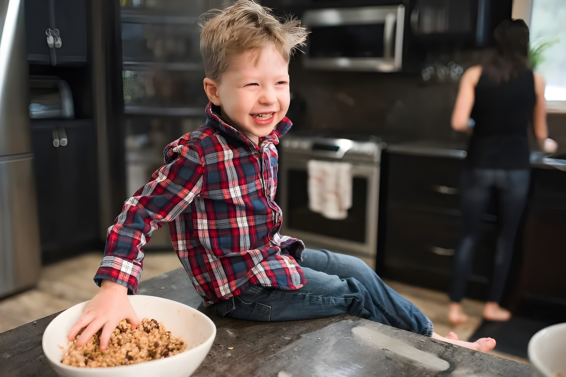 Young child eating as a family considers food allergy treatment goals