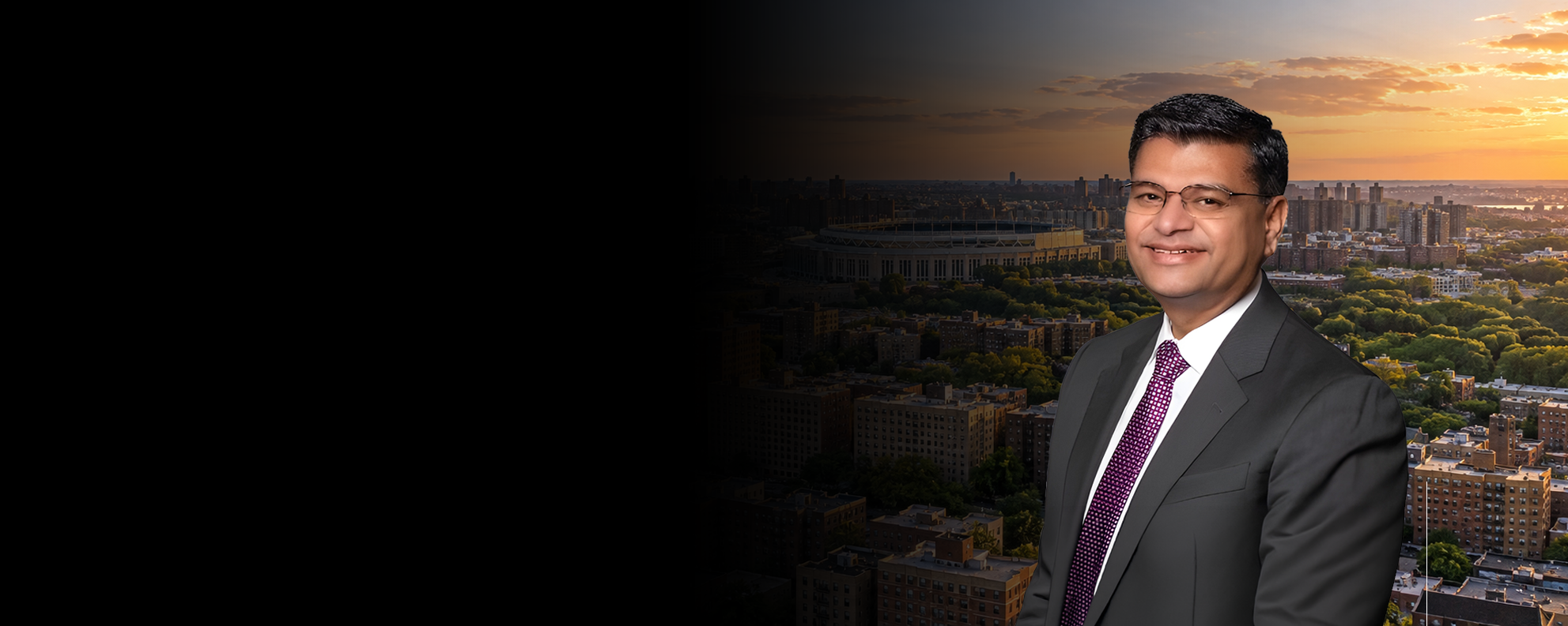 Dr. Atul Shah with a Bronx cityscape at sunset