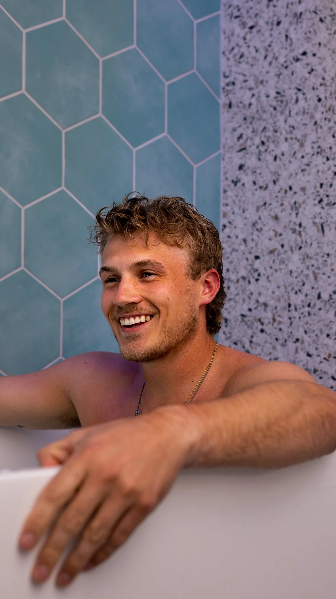 Guest using a private cold plunge at Optimum Health in Inver Grove Heights, Minnesota