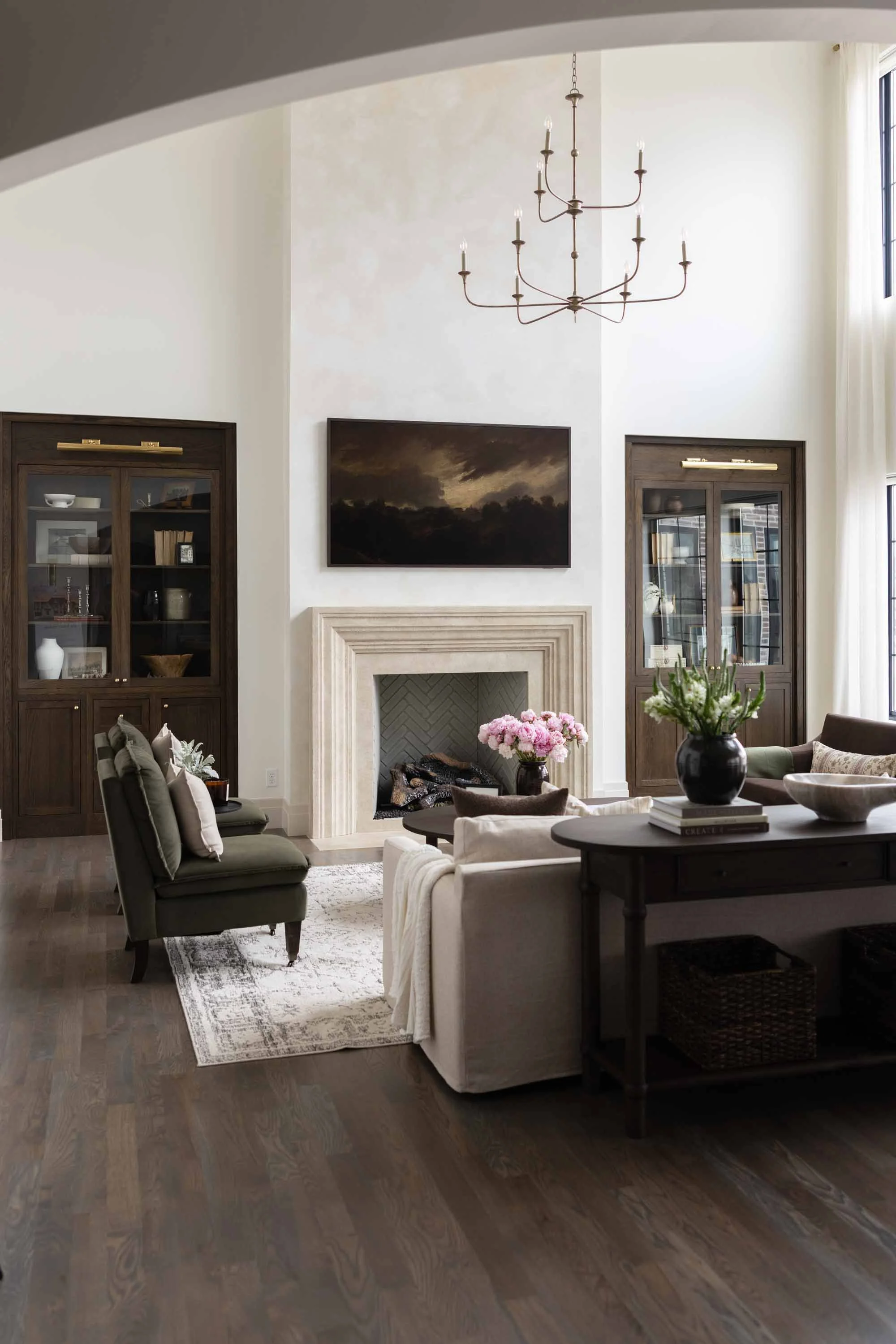 Lower level living room with a limestone fireplace