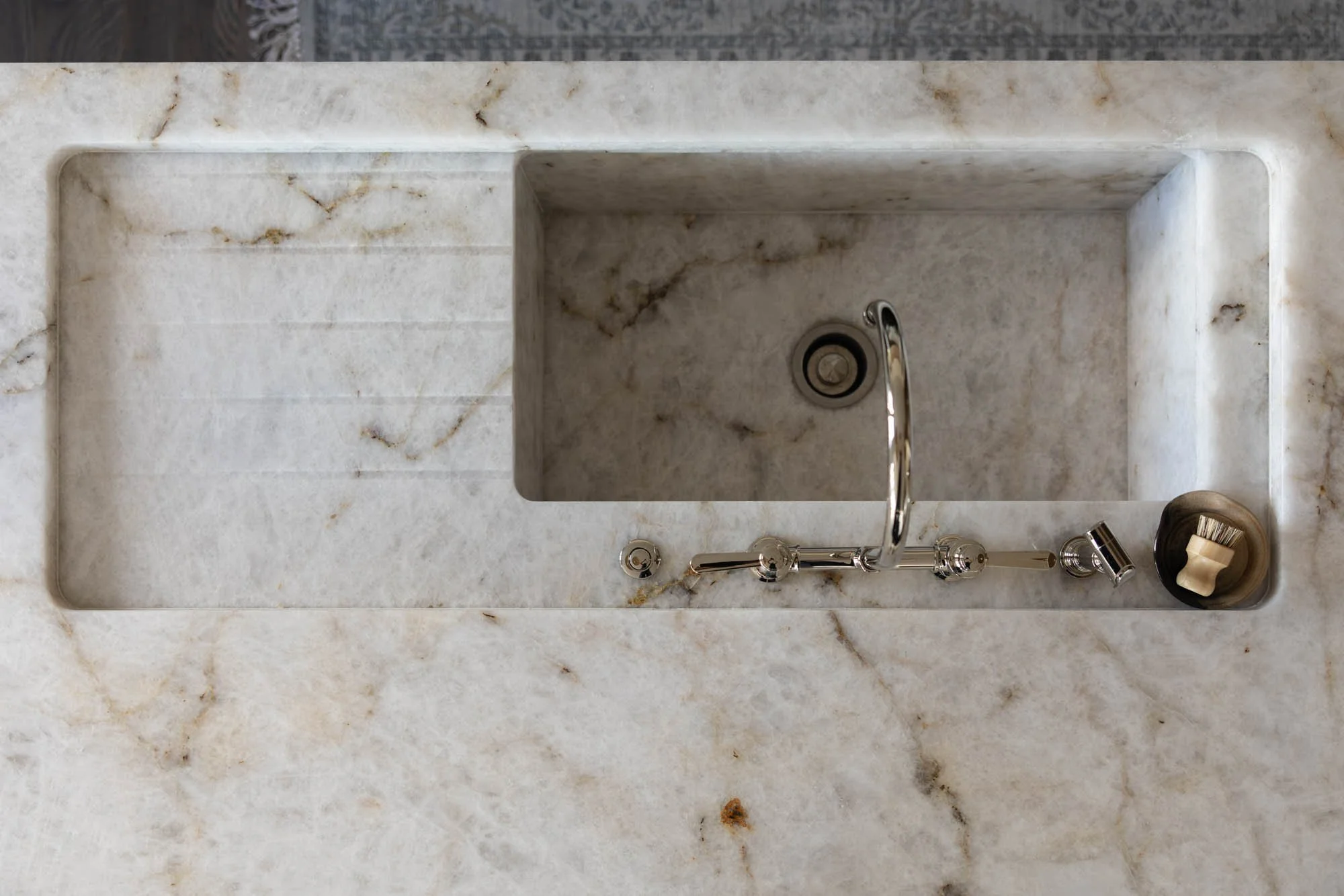 Carved marble apron sink