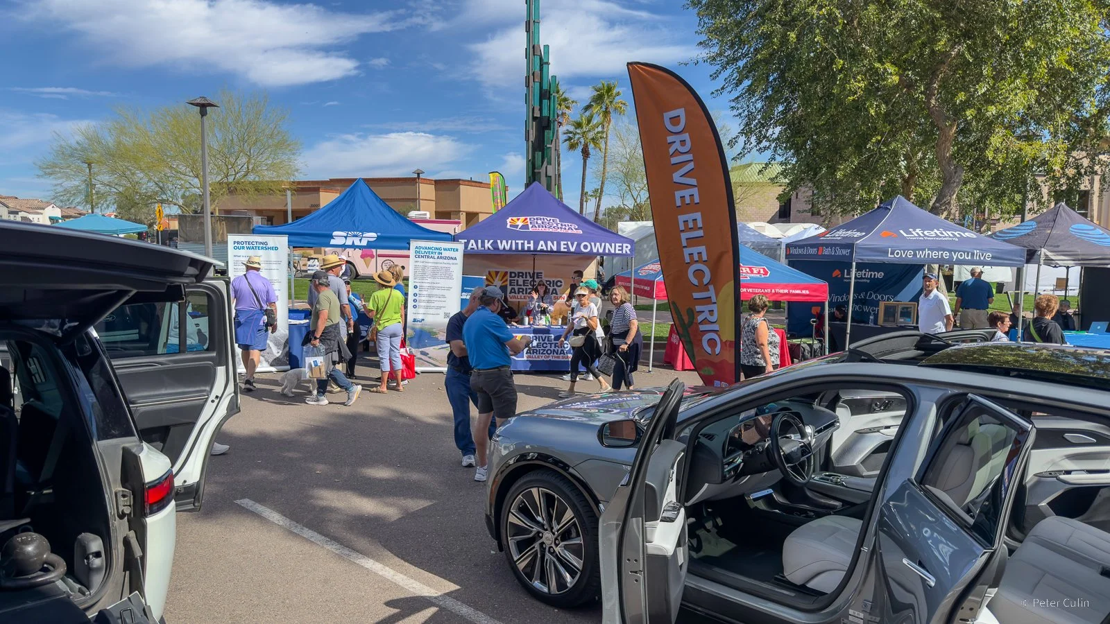 DRIVE Electric Arizona booth and electric vehicle display at a community event