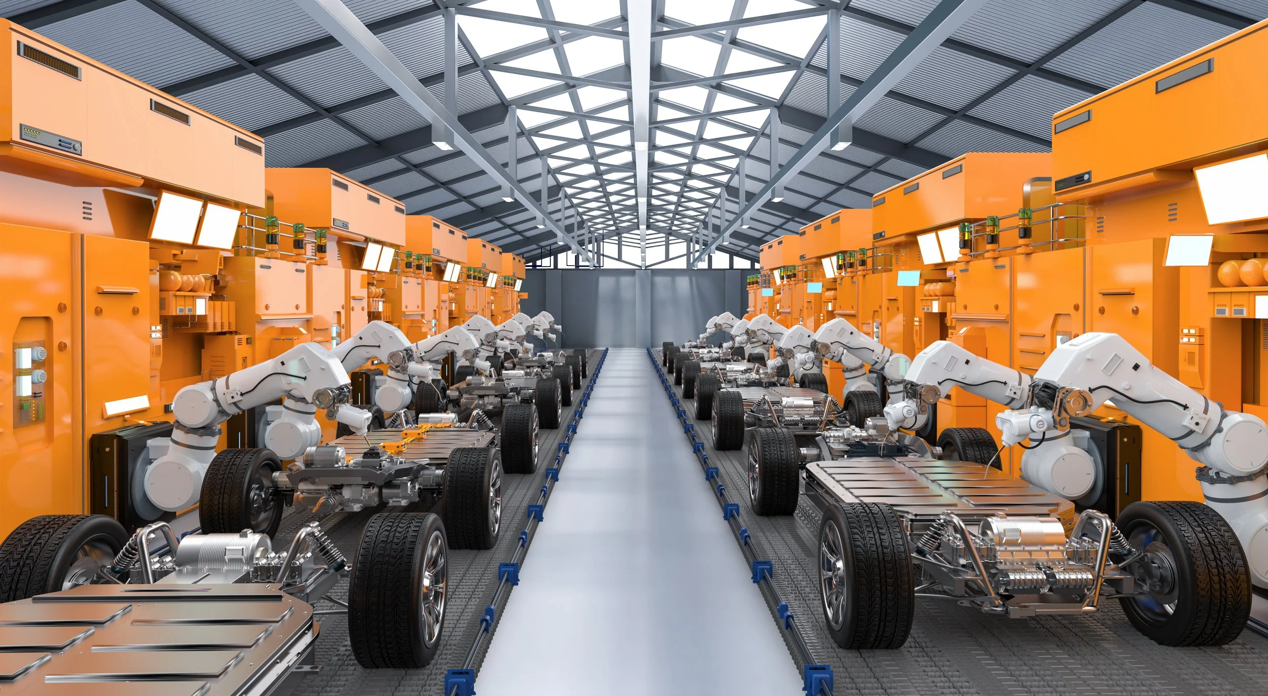Electric vehicles moving through an automotive assembly line