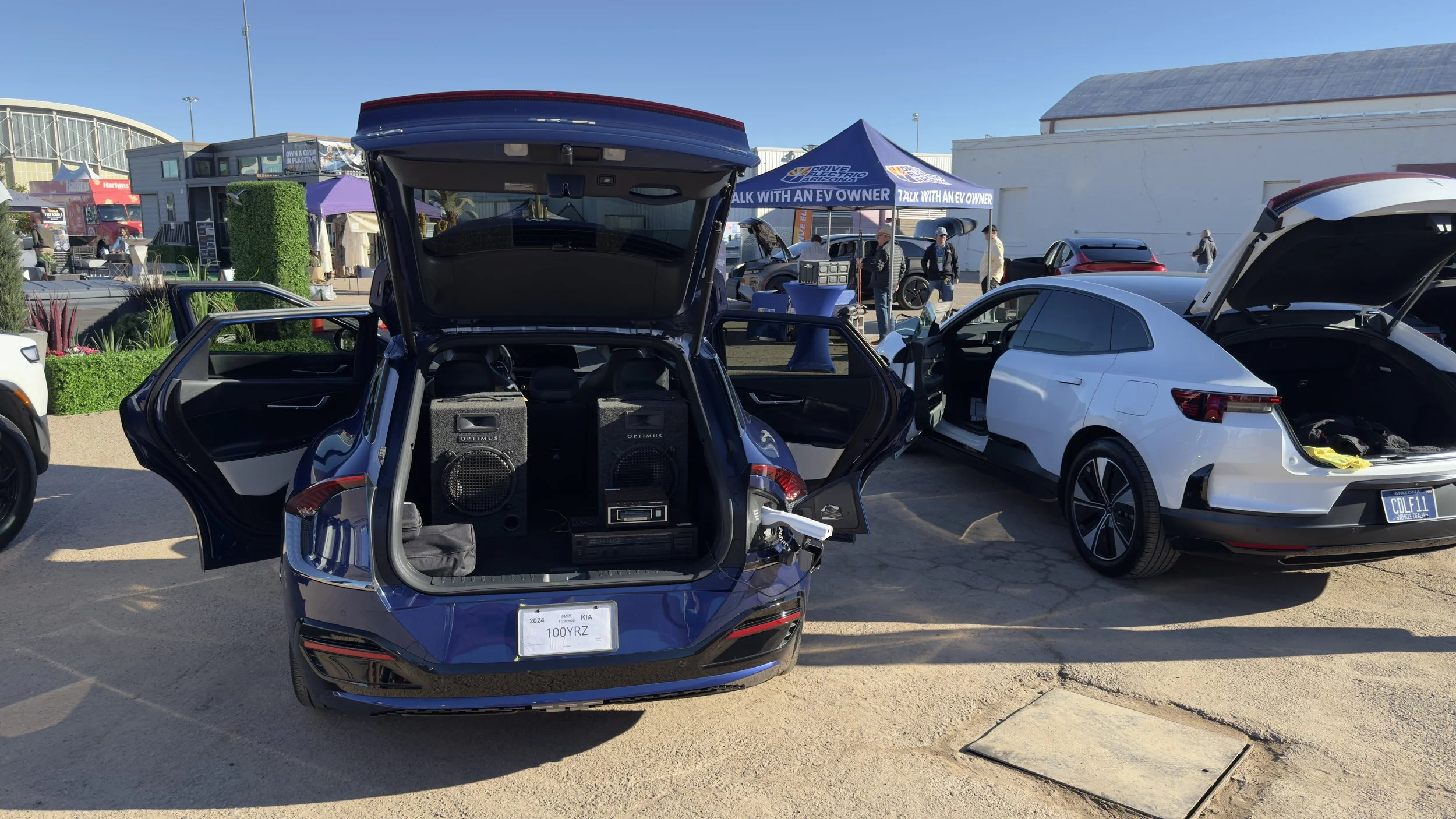 An 8-track player powered from the charge port of a Kia EV6 using Vehicle-to-Load technology