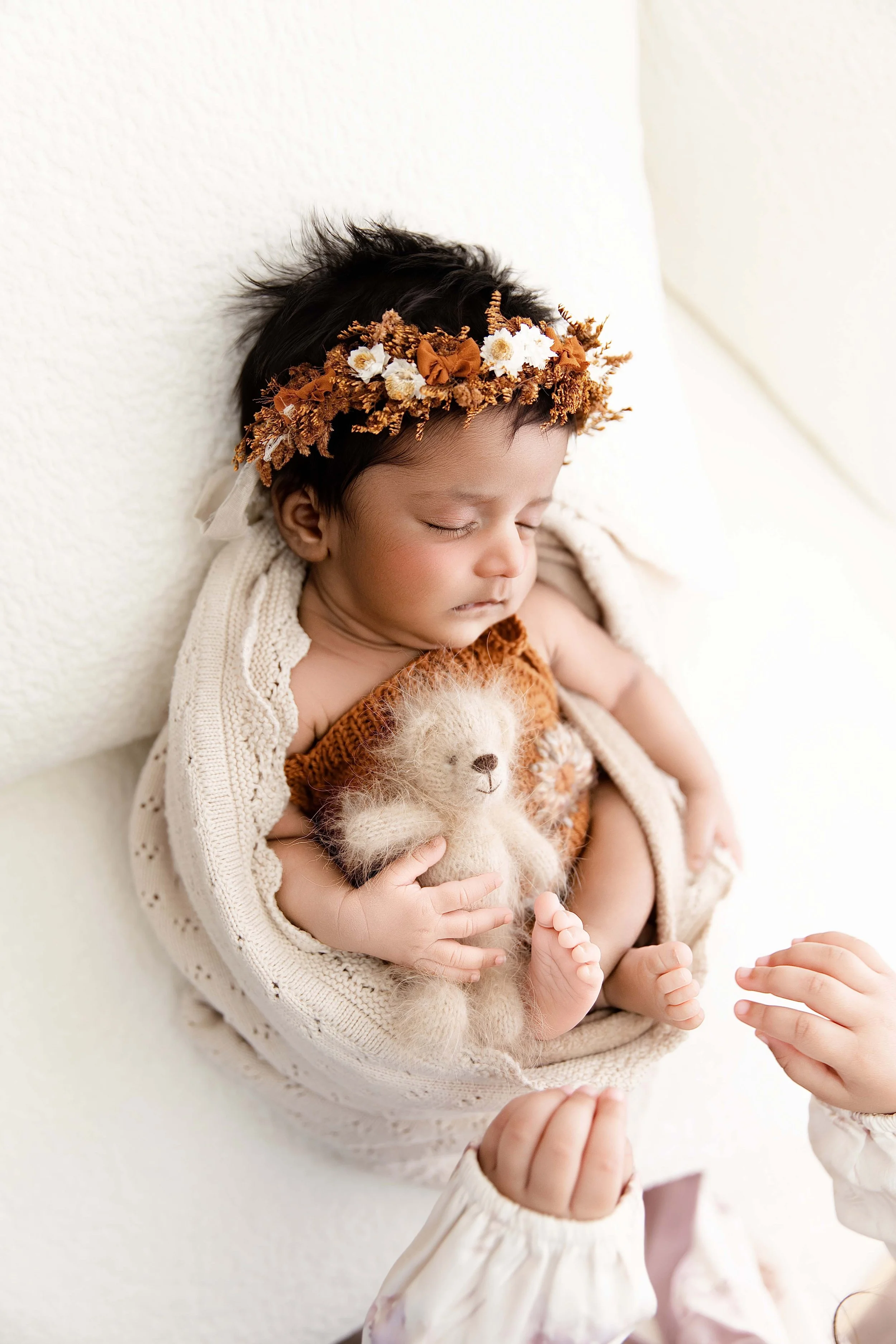 Posed newborn baby photographed for the Simply Baby newborn photography package at Lama's Littles