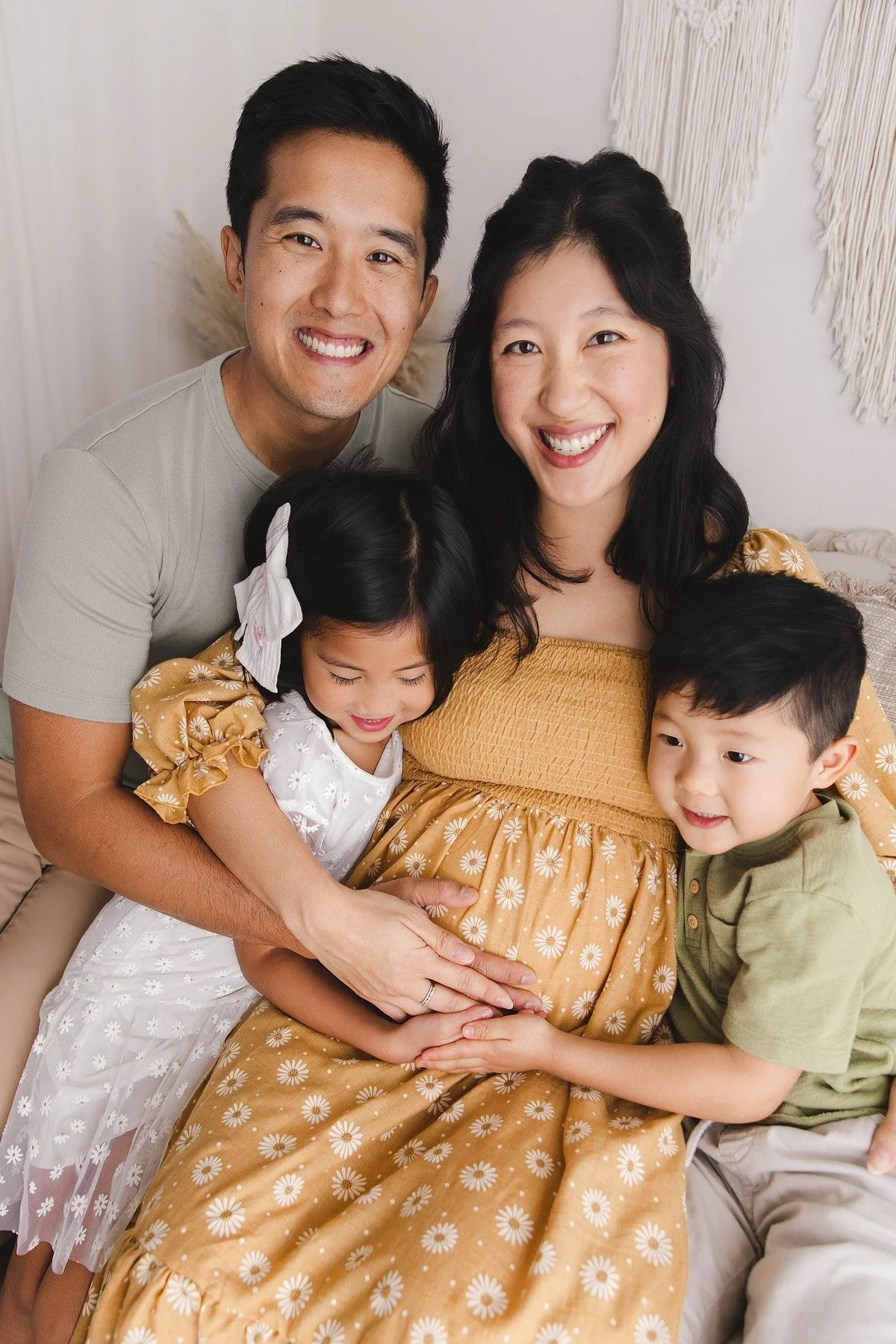 Lifestyle maternity photography in Allen, Texas: mother and children in a soft neutral studio, photographed by Manal Ansari