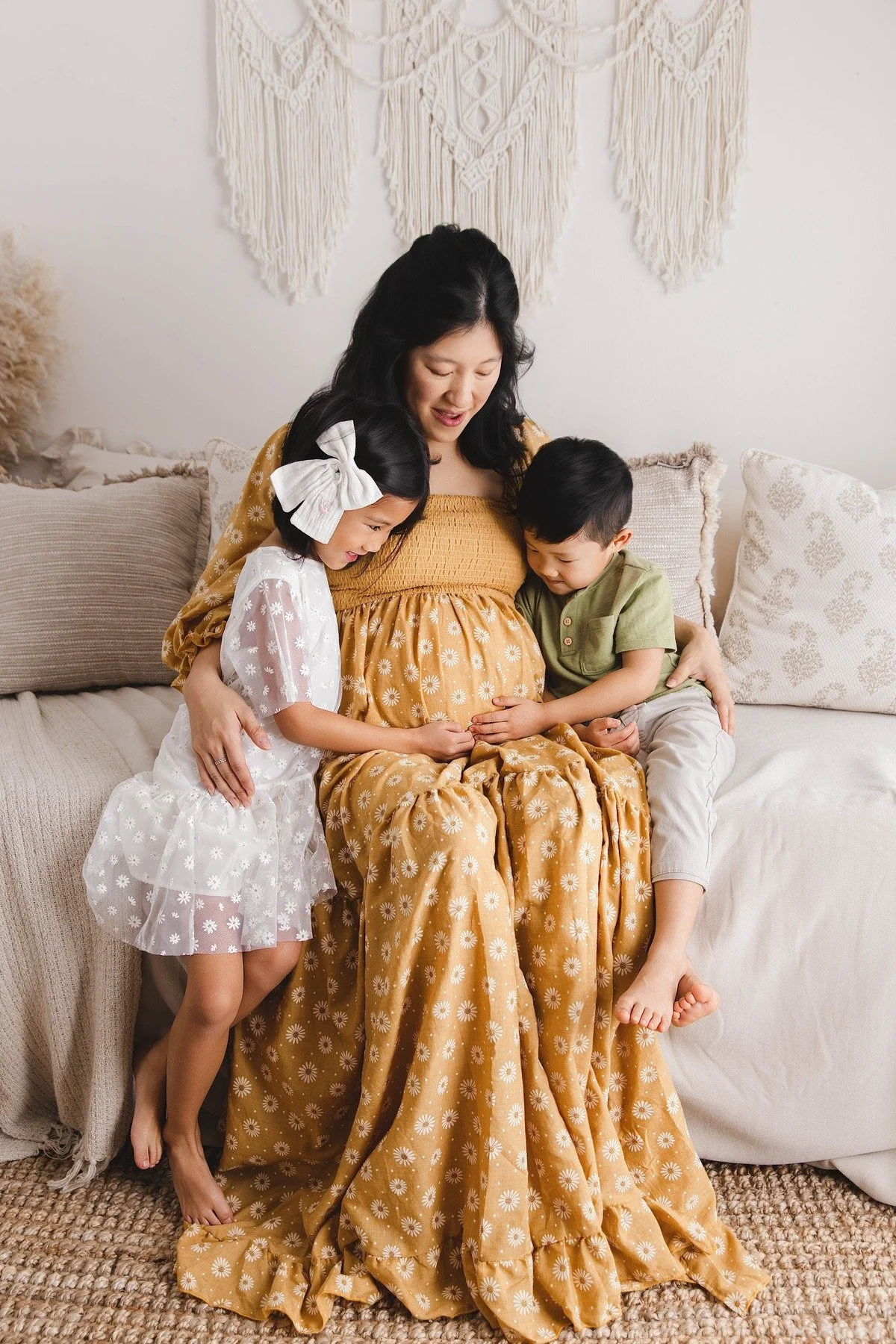 Lifestyle maternity photography in Allen, Texas: mother and children in a soft neutral studio, photographed by Manal Ansari