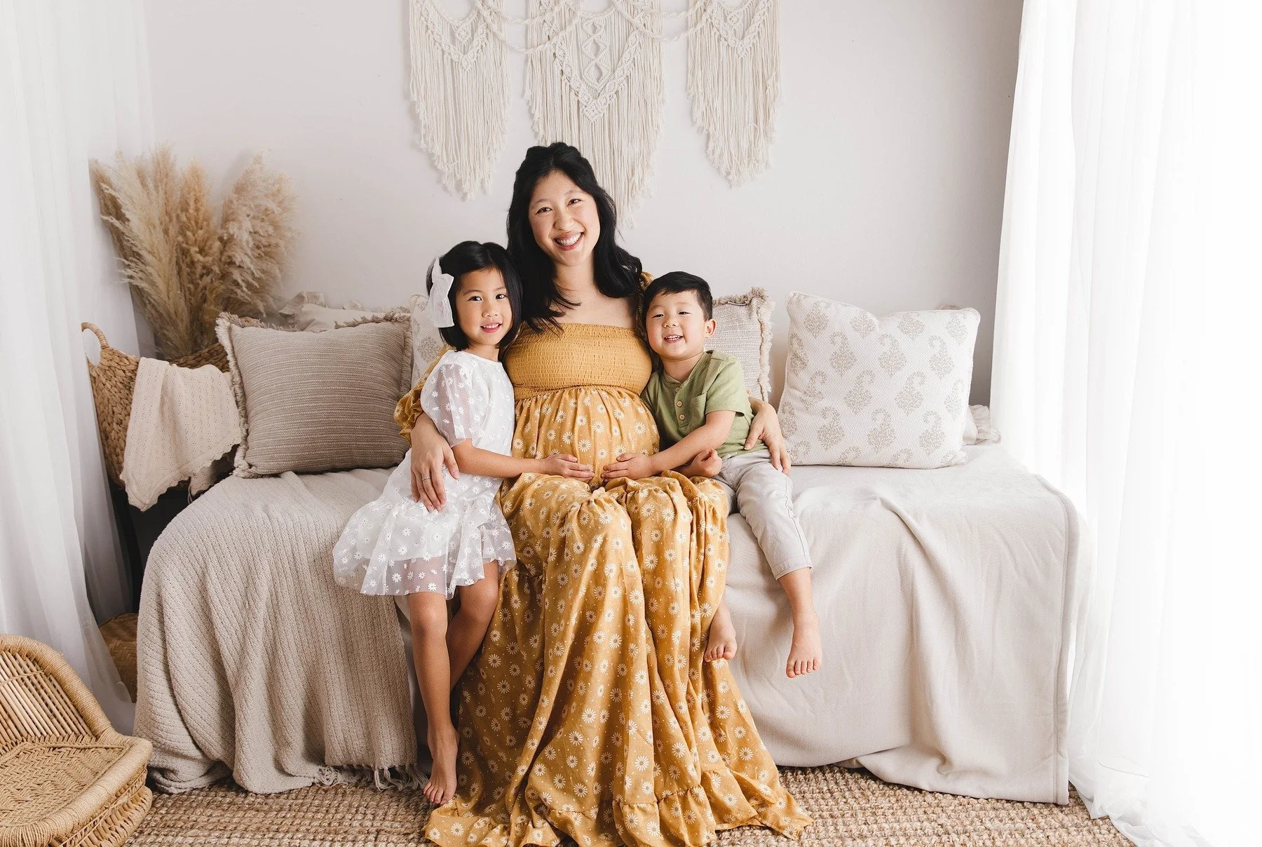 Mother and two smiling children during their lifestyle maternity session in Allen, TX, photographed by Manal Ansari