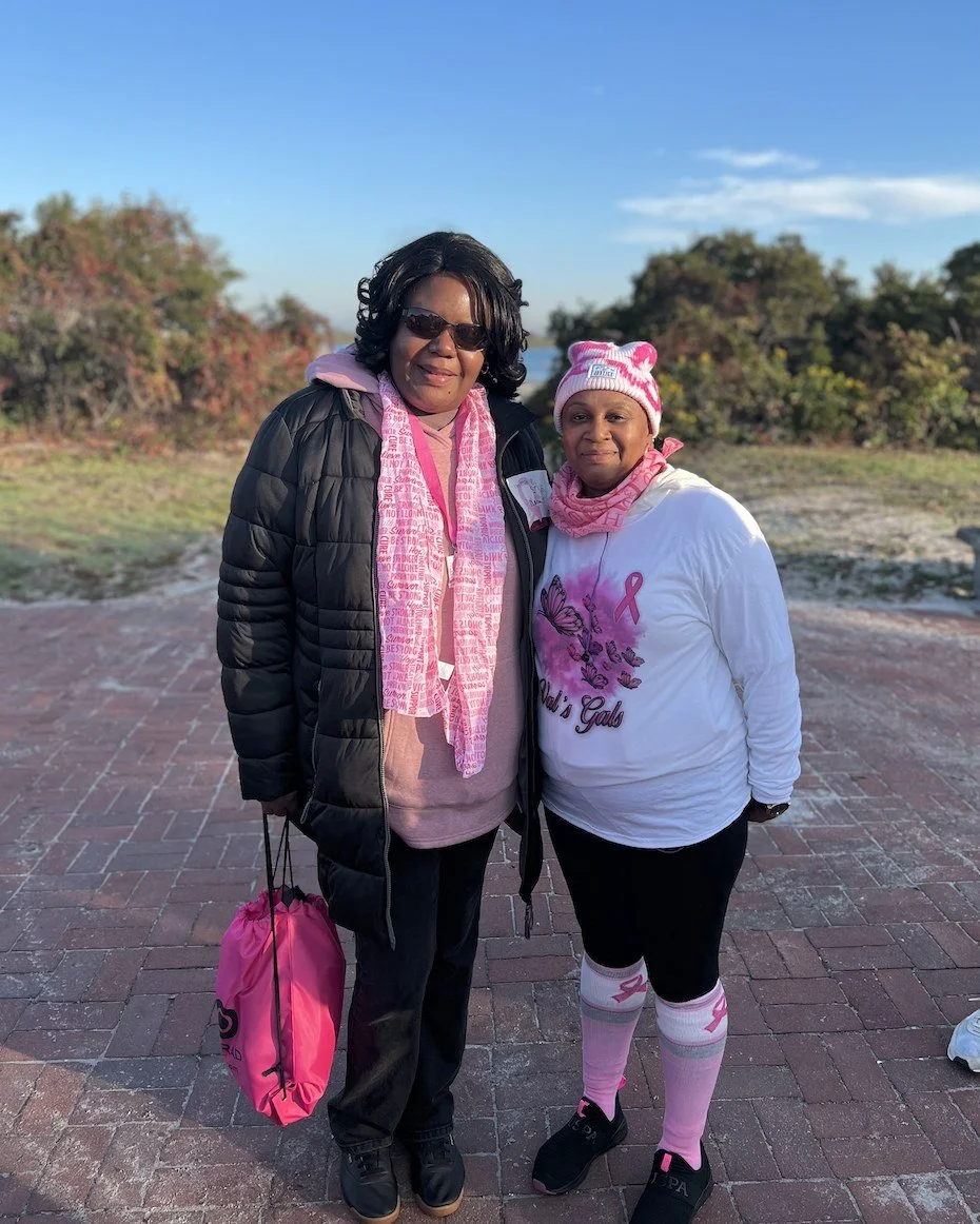 Two Love Fellowship Temple breast cancer survivors participating in a breast cancer awareness walk.