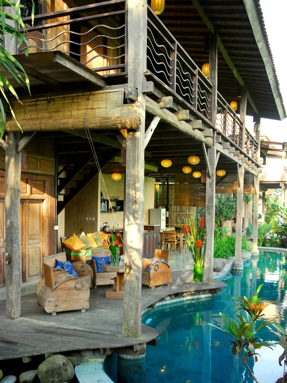 Residential architecture using reclaimed Ulin posts deck and balustrade around a swimming pool